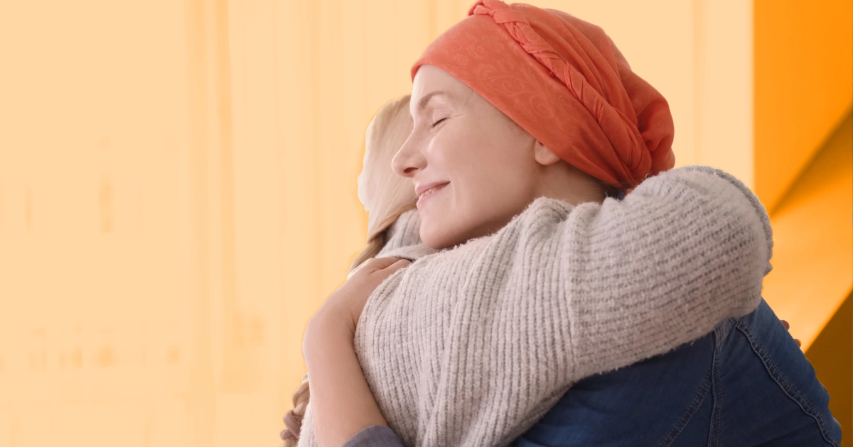 Hugging happy and relieved couple who recieved acupunture after cancer treatment